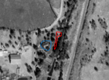 fuzzy gray photo with a red P-shaped section boundary and a blue circle around a house