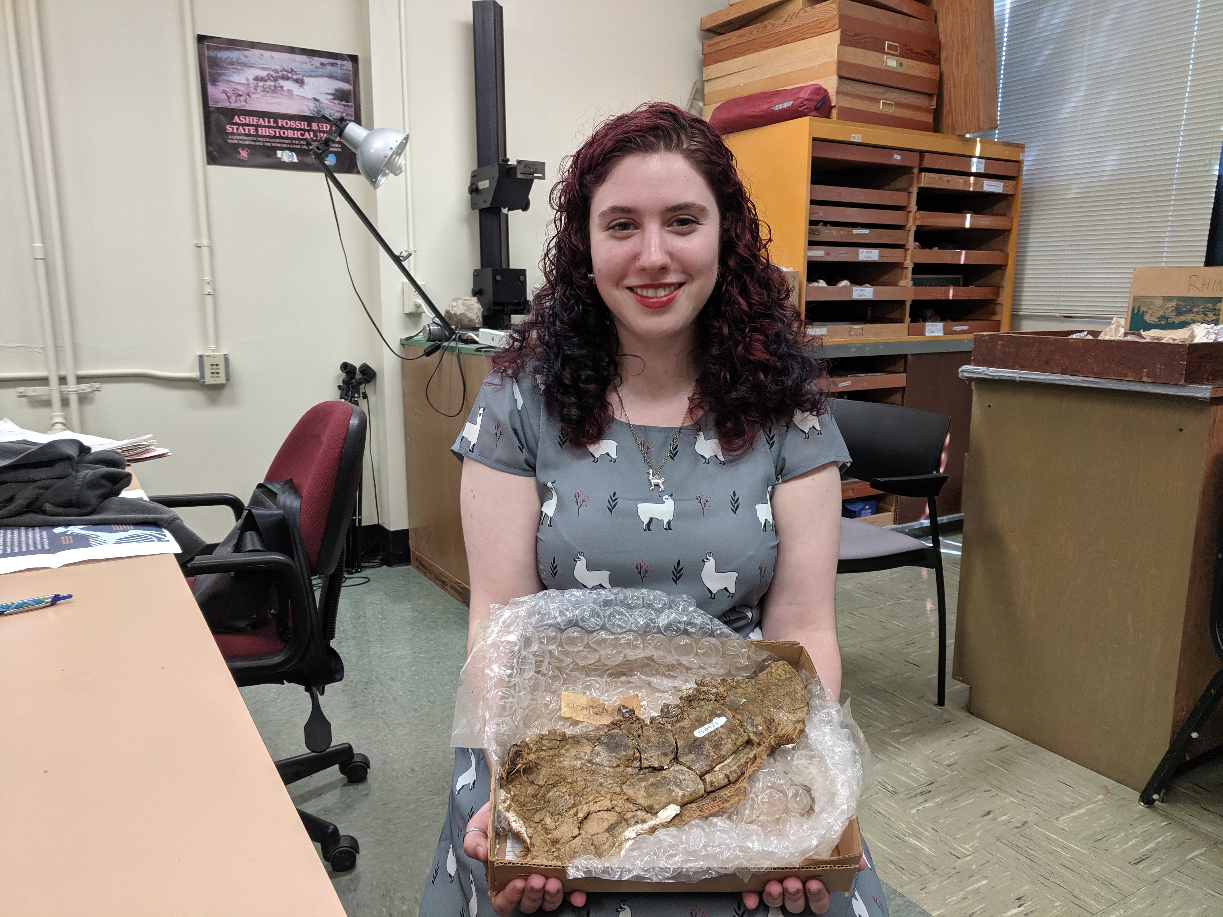 Selina with murder-cow fossil.jpg