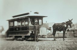 Historic photo of black man posing with streetcar