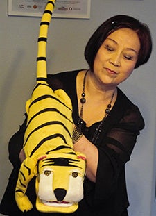 Yuqin Wang with tiger puppet
