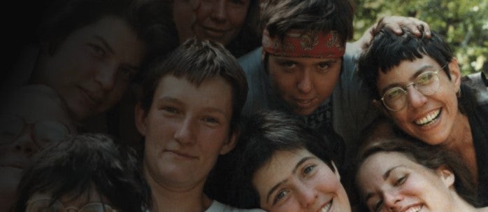 A group of queer women in a group photo.