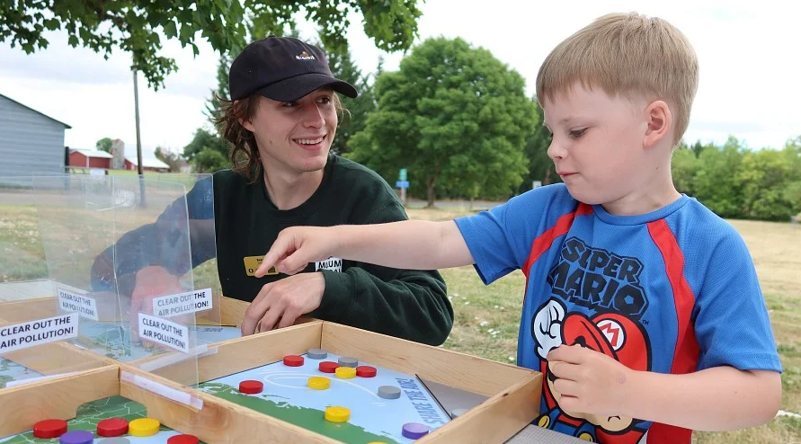 Outreach educator Bear Elliott (left) engaging kids in science