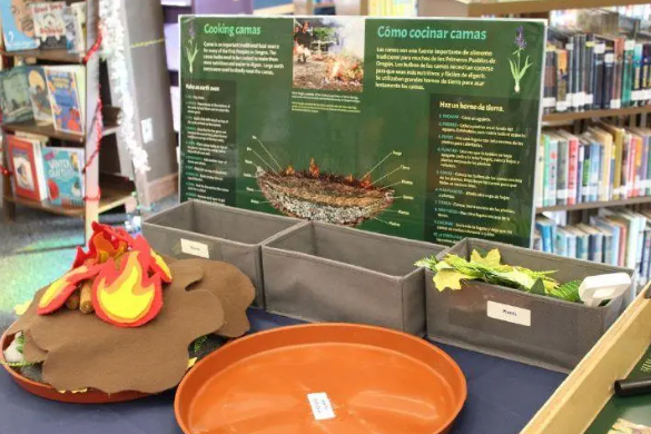 An exhibit station where visitors build a model earth oven