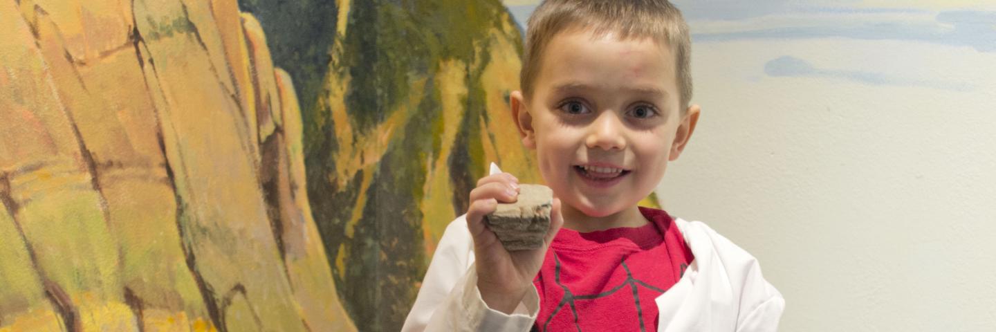 Preschooler with a fossil
