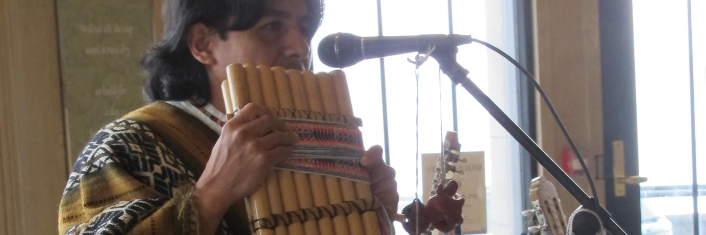 Alex Llumiquinga performing on a pan flute.