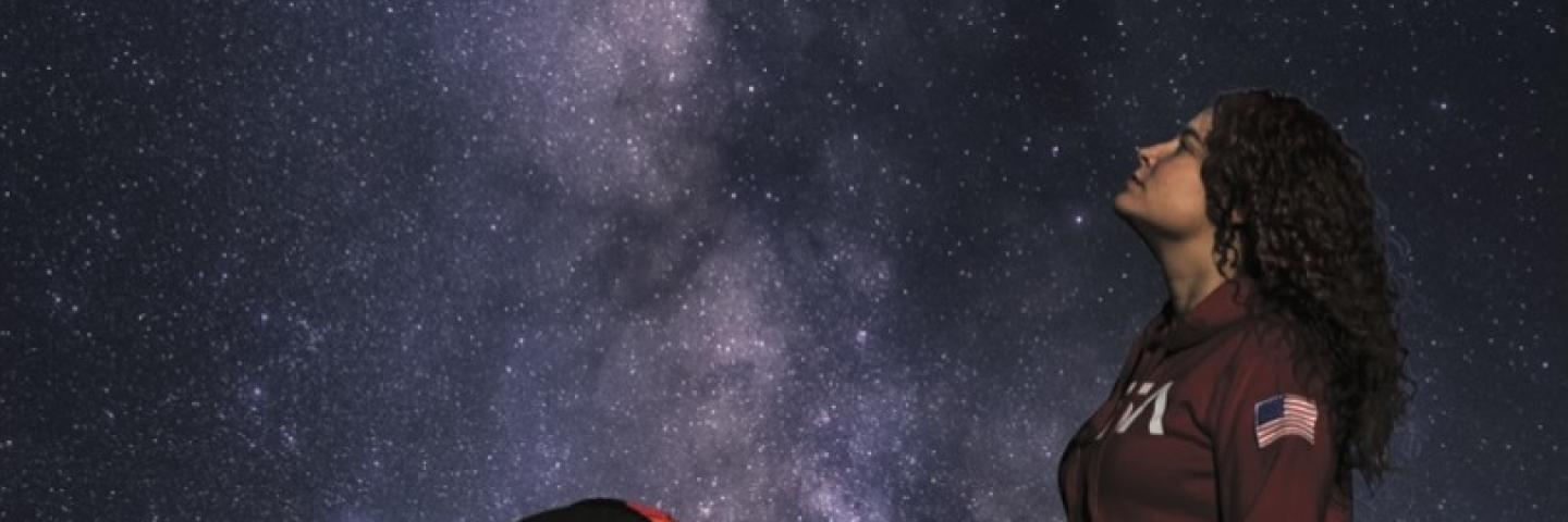 Poster for Space, Hope, and Charity, featuring a young white woman gazing up at a night sky with lots of stars.
