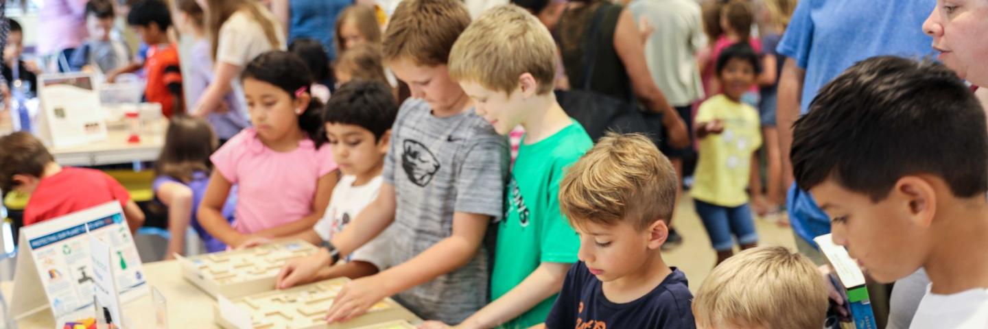 A group of children play a game in a library
