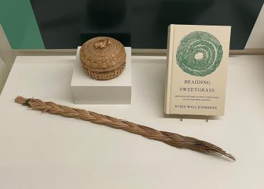 Small sweetgrass basket, braid of sweetgrass and the book Braiding Sweetgrass