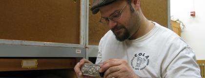 Student looking at a fossil in the paleontology collections