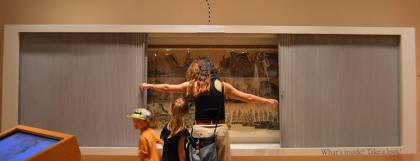 Family at Mapas exhibit