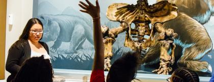 Tour group in front of giant sloth