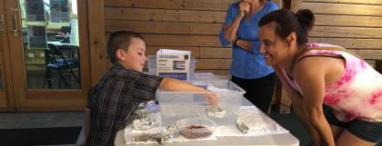 Family trying out the boat challenge