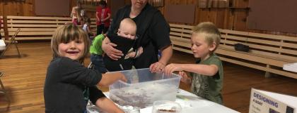 Family trying out the boat challenge v2