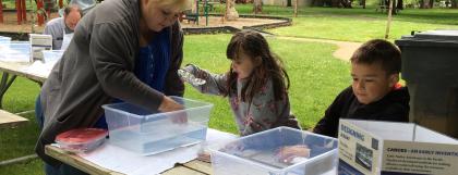 A family participating in a boat design challenge
