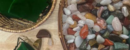 Small polished rocks in a basket