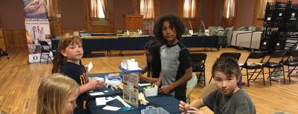 Children building a shelter together