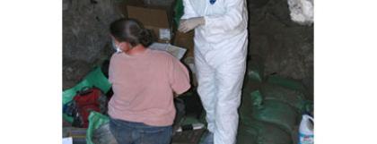 Suiting up to collect coprolite in Cave 2