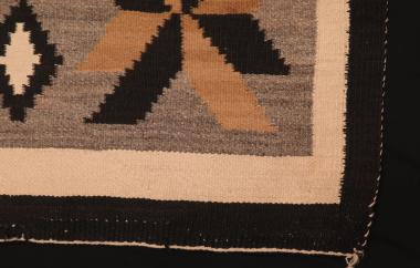 Closeup of bottom corner of southwestern weaving