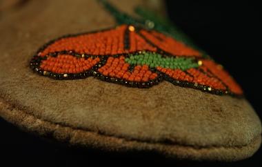 Beaded Moccasins detail: closeup on orange flower