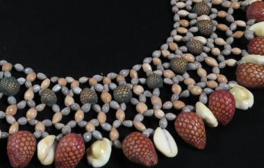 Beaded collar with seed beads, dyed large beads, and shells