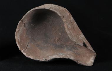 Sprouted ceramic crucible to hold ore or charcoal for metal smelting