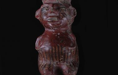 Vessel, Kneeling Human (front). Sculpted as an anthropomorphic vessel rather than a flat figurine, a headband ends the head abruptly above the face and doubles as the pot rim. Buff earthenware covered with stick-polished red slip, white and dark brown paint.