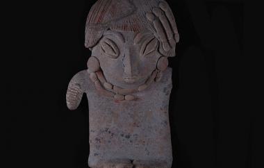 Male Human Figurine (front). Individual characteristics, such as hair, eyes, disc earrings, and double necklace, are filleted-- that is, applied as separate pellets to the main body.