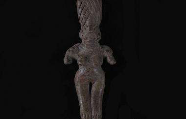 Female Human Figurine (front). While this figurine is overall rudimentary, great detail and emphasis were given to her truncated headdress. It flares toward the top and has been incised with decorative lines. Buff earthenware, polished, traces of red and white paint.