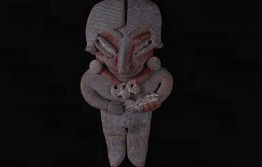 Female Human Figurine with Hands over Abdomen (front). Pointed projections on this figurine’s feet suggest footwear. The red paint of her three-part bracelet and necklace are still bright, and the oval pendants representing shells retain some of their white pigment. Buff earthenware, unpolished, traces of red and white paint.