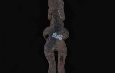 Female Human Figurine with Hands over Breasts (back)
