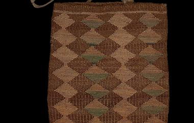 Cornhusk bag with exposed dogbane foundation (side one)