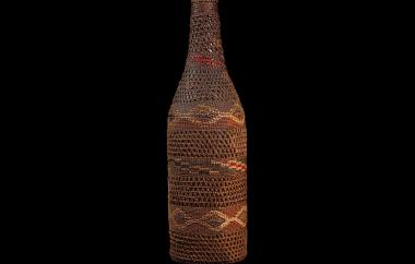 Basket-covered glass bottle view one