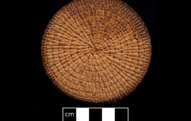 Basket-covered glass bottle view two