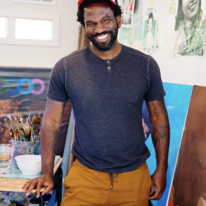 Jeremy Okai Davis grins at the camera 