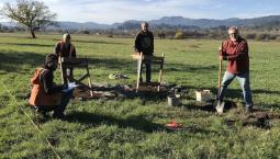 Crew excavating in field west of the old house.jpg