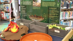 An exhibit station where visitors build a model earth oven