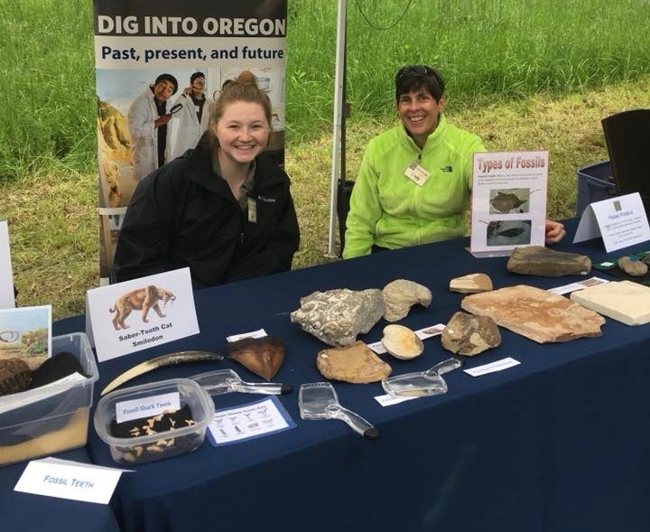 Volunteers displaying fossils at an outreach event 