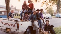 Lesbians posing with dogs on a truck