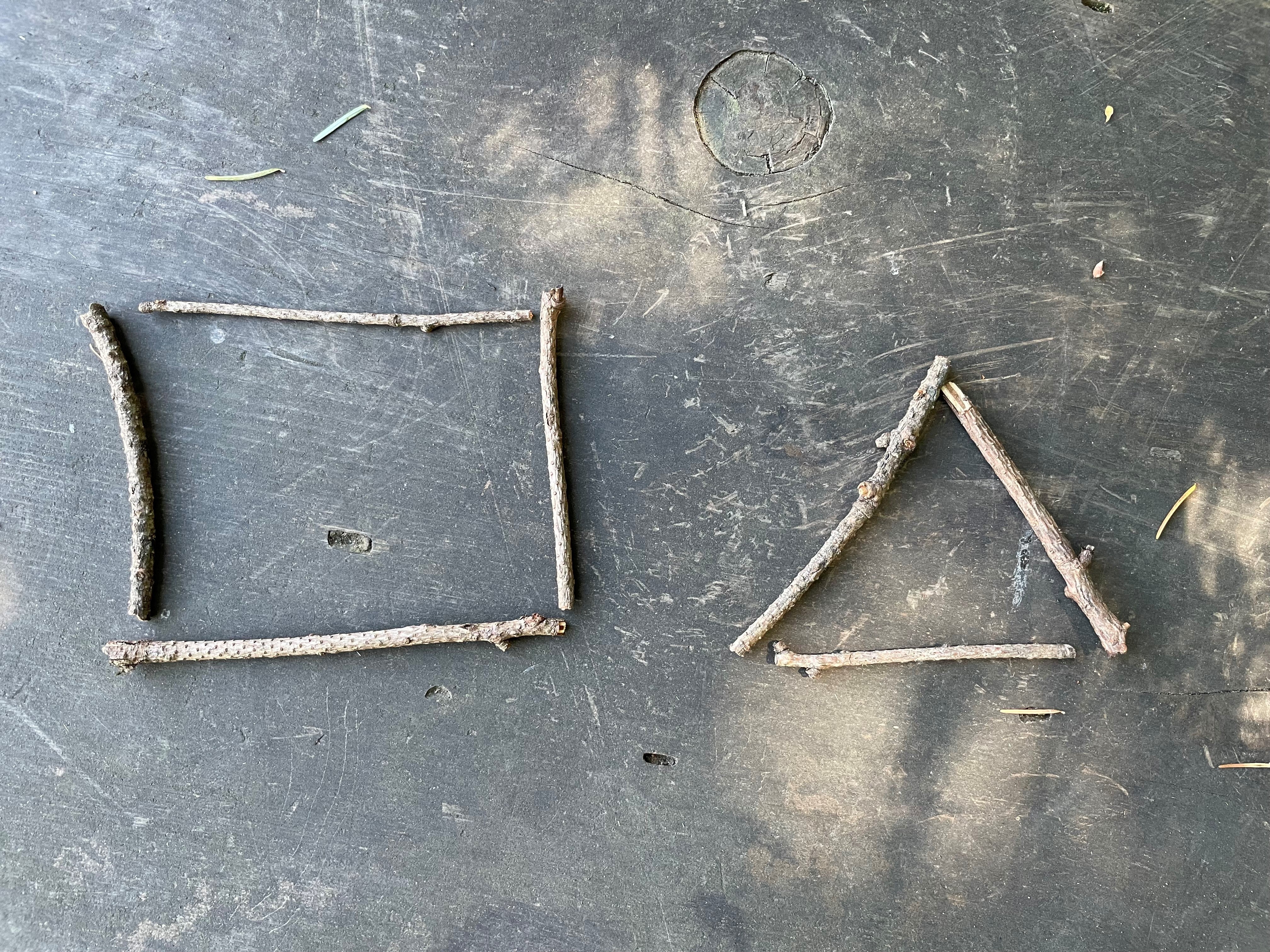 a series of stick that form a triangle and a square