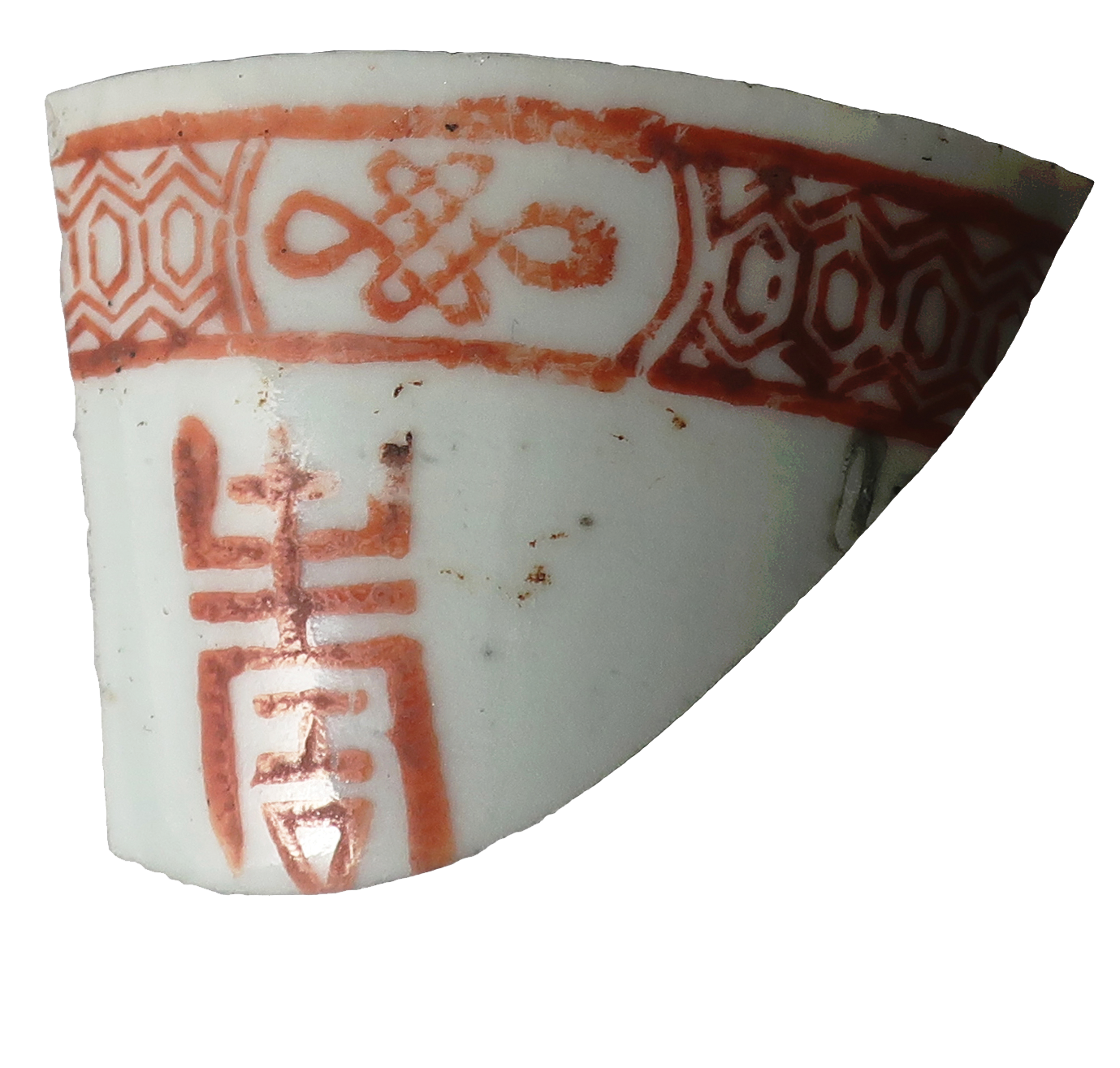 Broken teacup with red Chinese-style design