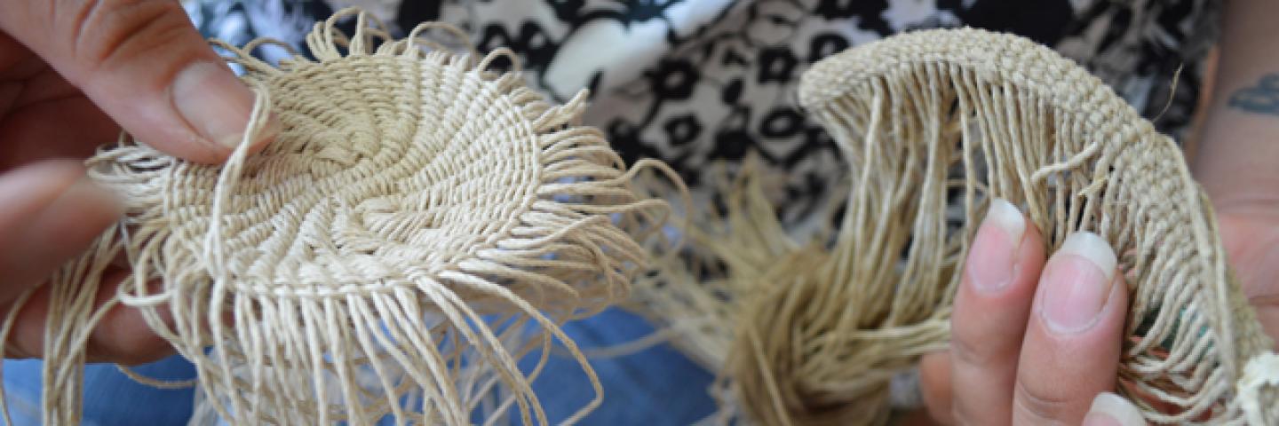 Kelli Palmer, a Native weaver in the Traditional Arts Apprenticeship Program, demonstrates her craft